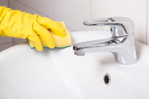Cleaner taking a safe pause during a cleaning task