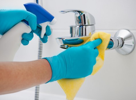 Supervisor checking a cleaning quality checklist during complaint review