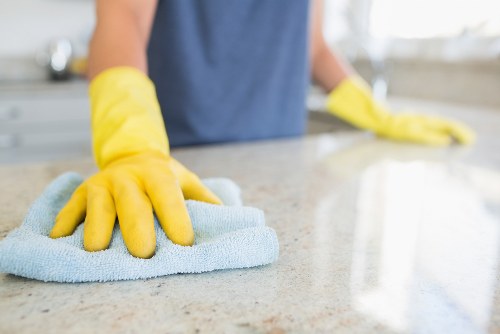 Professional domestic cleaner working in a Brixton kitchen